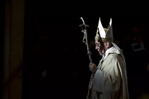 Pope Francis holds the pastoral staff as he leaves after celebrating a Mass in St. Peter's Basilica, at the Vatican, to mark Epiphany, Jan. 6, 2014. Pope Francis celebrates the 10th anniversary of his election Monday, March 13, 2023, far outpacing the "two or three" years he once envisioned for his papacy and showing no signs of slowing down. (AP Photo/Andrew Medichini, File)