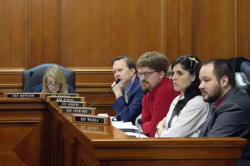 Democratic state Reps., from left, Denise Mentzer, Matt Koleszar, Joey Andrews, Jaime Churches and Dylan Wegela, listen as testimony is given during a House Labor Committee meeting, Wednesday, March 8 , 2023, in Lansing, Mich., on repealing the state's right-to-work law and restoring prevailing wages. (AP Photo/Joey Cappelletti)