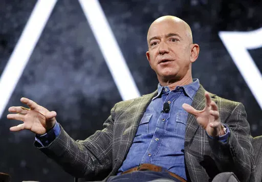 Then Amazon CEO Jeff Bezos speaks at the the Amazon re:MARS convention on June 6, 2019, in Las Vegas. Federal regulators are ordering Amazon founder Jeff Bezos and CEO Andy Jassy to testify in their investigation of Amazon Prime Wednesday, Sept. 21, 2022, rejecting the company’s complaint that the executives are being unfairly harassed in the government's probe of the popular streaming and shopping service. (AP Photo/John Locher, File)