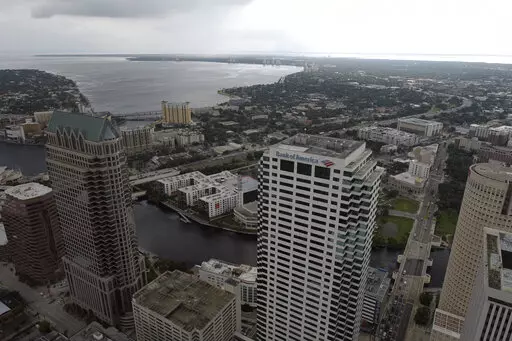 In this aerial image, the city of Tampa, Fla., is seen Monday, Sept. 26, 2022. Hurricane Ian was growing stronger as it barreled toward Cuba on a track to hit Florida's west coast as a major hurricane as early as Wednesday. It's been more than a century since a major storm like Ian has struck the Tampa Bay area, which blossomed from a few hundred thousand people in 1921 to more than 3 million today. (DroneBase via AP)