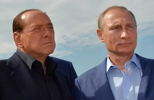 Russian President Vladimir Putin, right, and former Italian Prime Minister Silvio Berlusconi visit a memorial to the soldiers from Sardinia killed in the Crimean War, near Mount Gasfort outside Sevastopol in Crimea, Friday, Sept. 11, 2015. Berlusconi, the boastful billionaire media mogul who was Italy's longest-serving premier despite scandals over his sex-fueled parties and allegations of corruption, died, according to Italian media. He was 86.(Alexei Druzhinin/RIA-Novosti, Kremlin Pool Photo v