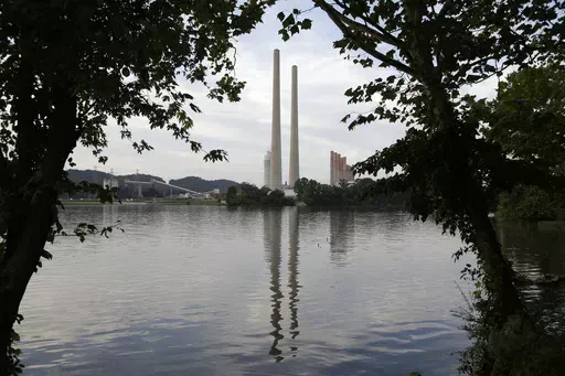 In this Aug. 7, 2019, photo, the Kingston Fossil Plant stands near a waterway in Kingston, Tenn. The nation’s largest public utility is moving ahead with a plan for a new natural gas plant in Tennessee despite warnings that its environmental review of the project doesn’t comply with federal law. The Environmental Protection Agency asked the Tennessee Valley Authority in a March 25, 2024 letter to redo several aspects of its environmental impact statement for converting the coal-burning Kings