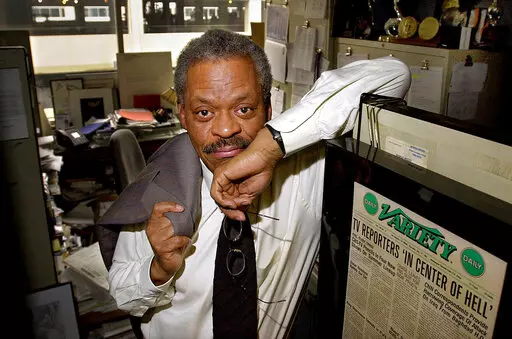 CNN anchor Bernard Shaw poses in his office at CNN's Washington bureau on Feb. 15, 2001. Shaw, who was CNN's original chief anchor when the network started in 1980, died of pneumonia in Washington on Wednesday, Sept. 7, 2022, according to Tom Johnson, the network's former chief executive. Shaw was 82. (AP Photo/Alex Brandon, File)