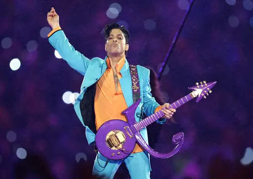 In this Feb. 4, 2007, file photo, Prince performs during the halftime show at the Super Bowl XLI football game in Miami. The six-year legal battle over pop superstar Prince’s estate has ended, meaning the process of distributing the artist's wealth could begin in February 2022. (AP Photo/Chris O'Meara, File)