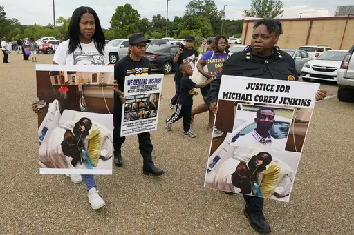 Activists march towards the Rankin County Sheriff's Office in Brandon, Miss., Wednesday, July 5, 2023, calling for the termination and prosecution of Rankin County Sheriff Bryan Bailey for running a law enforcement department that allegedly terrorizes and brutalizes minorities. Six white former law enforcement officers in Mississippi have pleaded guilty to a racist assault on Michael Corey Jenkins and his friend Eddie Terrell Parker, who are Black. (AP Photo/Rogelio V. Solis, File)