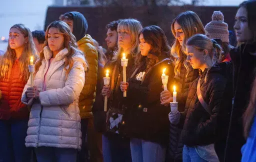Boise State University students, along with people who knew the four University of Idaho students who were found killed in Moscow, Idaho, days earlier, pay their respects at a vigil held in front of a statue on the Boise State campus, Thursday, Nov. 17, 2022, in Boise, Idaho. The arrest of Bryan Christopher Kohberger in the Nov. 13, 2022 fatal stabbings of four University of Idaho students has brought relief to the small college town of Moscow, Idaho.(Sarah A. Miller/Idaho Statesman via AP, File