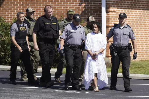 CORRECTS SPELLING OF FIRST NAME TO DANILO INSTEAD OF DANELO - Law enforcement officers escort Danilo Cavalcante from a Pennsylvania State Police barracks in Avondale Pa., Wednesday, Sept. 13, 2023. Cavalcante was captured Wednesday after eluding hundreds of searchers for two weeks. (AP Photo/Matt Rourke)