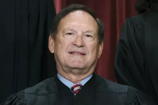 Associate Justice Samuel Alito joins other members of the Supreme Court as they pose for a new group portrait, Oct. 7, 2022, at the Supreme Court building in Washington. Alito rejects calls to step aside from Supreme Court cases on Trump and Jan. 6. (AP Photo/J. Scott Applewhite, File)