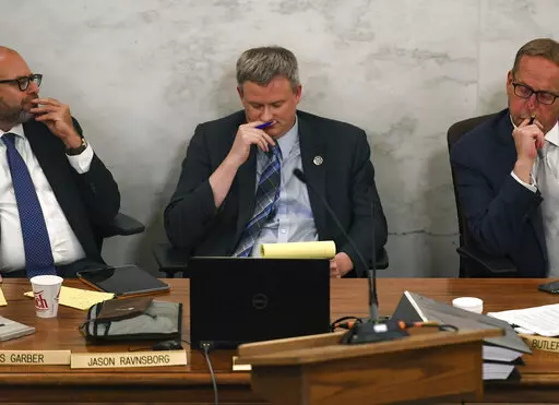 Attorney General Jason Ravnsborg reacts to the successful vote to impeach and remove him from office on Tuesday, June 21, 2022, at the South Dakota State Capitol in Pierre, S.D. The South Dakota Senate on Tuesday convicted Ravnsborg of two impeachment charges stemming from a 2020 car crash in which he killed a pedestrian, immediately removing him and barring him from serving in public office again. (Erin Woodiel/The Argus Leader via AP)