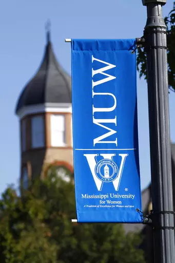  A banner for Mississippi University for Women hangs at the campus in Columbus, Miss., on Oct. 27, 2008. President Nora Miller said in a letter to alumni in the fall semester of 2022 that the university, which has also been enrolling men for 40 years, should consider a new name that is more inclusive. (AP Photo/Rogelio V. Solis, File)