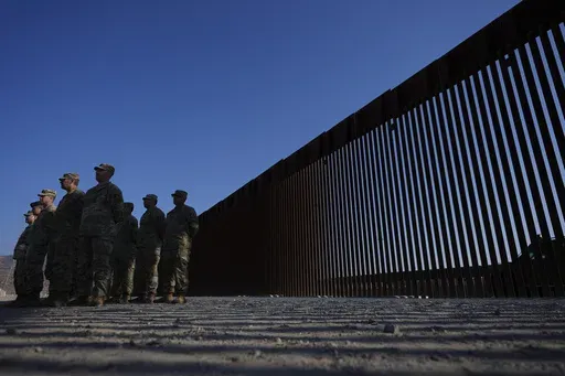 Members of the California National Guard listne during a news conference near the Otay Mesa Port of Entry along the border with Mexico, Dec. 5, 2024, in San Diego. (AP Photo/Gregory Bull, File)