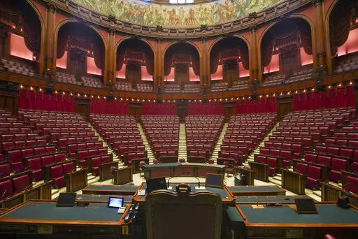 A view of the hemicycle inside Italy's Lower Chamber Montecitorio Palace, in Rome, Wednesday, Sept. 16, 2020. Forming a new government in Italy involves time and decades-old rituals, so although far-right leader Giorgia Meloni emerged as the clear winner in elections last month, the process of getting a new ruling coalition up and running will take time, maybe weeks. (AP Photo/Andrew Medichini, File)