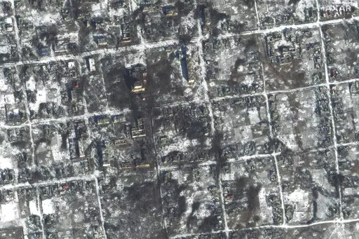 This satellite image provided by Maxar Technologies shows damaged areas in Petrivka of the Donetsk region, Ukraine, Friday, Feb. 10, 2023. (Maxar Technologies via AP)