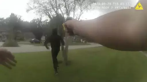 In this image taken from Jacksonville (Florida) Sheriff's Office body camera video, suspect Le'Keian Woods is hit with a Taser stun gun as he is chased by a Jacksonville police officer after fleeing a vehicle that was stopped during a traffic stop Friday, Sept. 29, 2023, in Fla. A Florida sheriff released the body camera video Monday, Oct. 2, that he says shows his officers were justified when they repeatedly punched, elbowed and kneed Woods, a drug suspect, who gave chase after being pulled ove