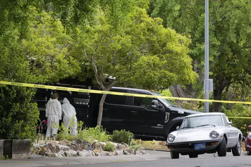 Police investigators are seen at the home of stabbing suspect Carlos Dominguez, 21, on Hawthorn Lane in Davis, Calif., on Thursday, May 4, 2023. A 21-year-old who had been a student at the University of California, Davis, until last week was arrested for allegedly stabbing three people, including two fatally, and sending fear through the quiet college community, city police said. Davis Police Chief Darren Pytel said Dominguez was taken into custody after 15 people called in reports of a person w