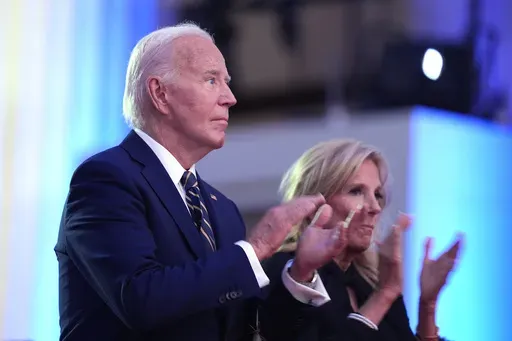 President Joe Biden, left, and first lady Jill Biden applaud before Biden delivers remarks on the 75th anniversary of NATO at the Andrew W. Mellon Auditorium, Tuesday, July 9, 2024, in Washington. (AP Photo/Evan Vucci)
