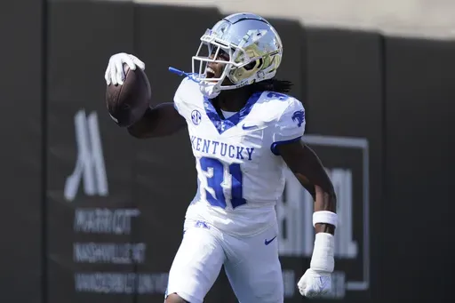 Kentucky defensive back Maxwell Hairston (31) celebrates his interception for a touchdown against Vanderbilt in the first half of an NCAA college football game Saturday, Sept. 23, 2023, in Nashville, Tenn. (AP Photo/George Walker IV, File)