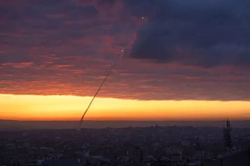 Anti-aircraft missiles are launched from the Gaza Strip after an Israeli airstrike, Thursday, Feb. 23, 2023. The Israeli military said Palestinian militants fired six rockets toward the country's south early Thursday. Israeli aircraft then struck several targets in northern and central Gaza. There were no reports of injuries in Israel or Gaza. The rocket fire followed a deadly Israeli military raid in the West Bank on Wednesday. (AP Photo/Fatima Shbair)