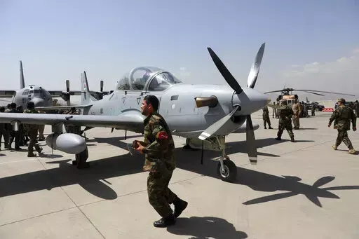 A-29 Super Tucano planes are on display during a handover from the NATO-led Resolute Support mission to the Afghan army at the military Airport in Kabul, Afghanistan, Sept. 17, 2020. A year-old report by Washington’s Afghanistan watchdog warned in early 2021, months before President Joe Biden announced the end to America’s longest war, the Afghan air force would collapse without critical U.S. aid, training and American maintenance. The report by the Special Inspector General for Afghanistan 
