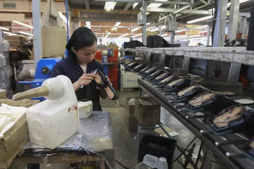 A woman works in a shoe maquiladora or factory in Leon, Mexico, Feb. 7, 2023. For the first time in more than two decades, Mexico last year overtook China as America's top supplier of goods — a shift that reflects political tensions between Washington and Beijing and U.S. efforts to import from countries that are friendlier and closer to home. (AP Photo/Mario Armas, File)