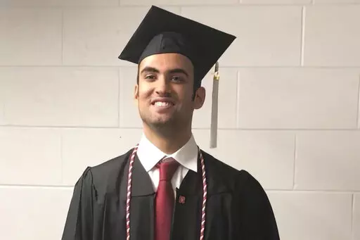 Prince Abdullah bin Faisal al Saud wears cap and gown for his undergraduate graduation from Northeastern University in Boston, in 2018. Tough prison sentences that Saudi Arabia has handed the Saudi student and a Saudi-American citizen suggest Saudi Crown Prince Mohammed bin Salman is maintaining or escalating a crackdown on Saudi dissidents in the West, Saudi exiles and rights groups say. The Saudi prince who was attending graduate school in Boston is the latest person targeted as part of what t