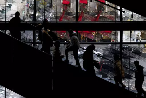 Shoppers walk up and down the stairs in a Nike store on Black Friday, Nov. 25, 2022, in New York. Mistakes during the holiday season can be detrimental to a business’s bottom line — but small-business owners still have time to put themselves in the best position for success. To avoid common holiday mistakes, business owners should plan ahead and use historical data to anticipate their seasonal needs. (AP Photo/Julia Nikhinson, File)