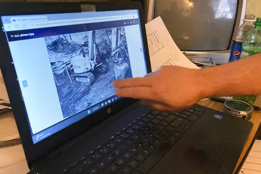 Treasure hunter Dennis Parada, owner of Finders Keepers, talks about the FBI's 2018 dig for Civil War-era gold in an interview at his office in Clearfield, Penn., Jan. 6, 2023. Parada is pressing the FBI to release more documents related to the dig, which he suspects found gold but which the FBI insists came up empty. (AP Photo/Michael Rubinkam)