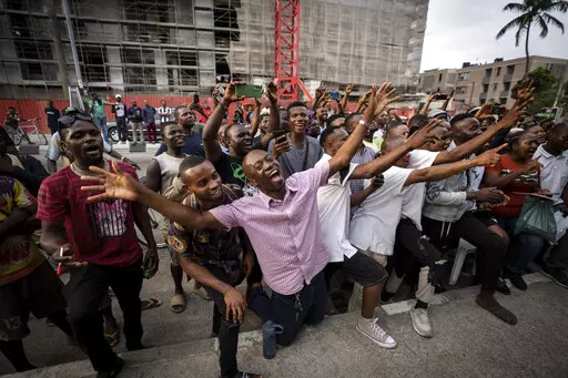 Party agents and supporters of presidential candidate Peter Obi of the Labour Party cheer as their candidate wins the count at a polling station near to the home of ruling party presidential candidate Bola Tinubu, in Lagos, Nigeria Saturday, Feb. 25, 2023. Voters in Africa's most populous nation are heading to the polls Saturday to choose a new president, following the second and final term of incumbent Muhammadu Buhari. (AP Photo/Ben Curtis)