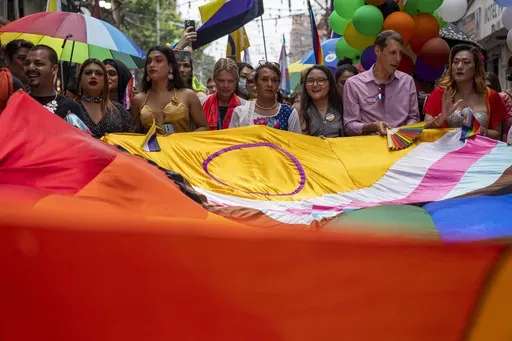 LGBTQ+ people and their supporters rally during the annual pride parade, in Kathmandu, Nepal, Tuesday, Aug. 20, 2024. (AP Photo/Niranjan Shrestha)