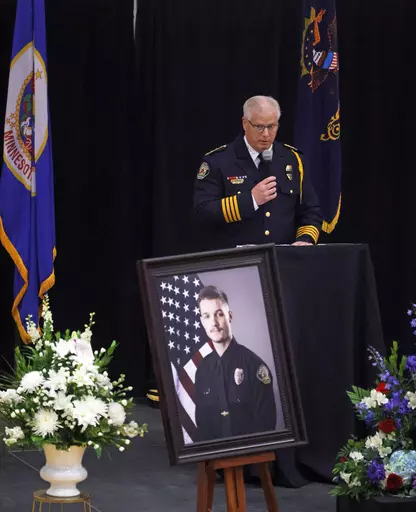 Fargo Police Chief David Zibolski speaks during funeral services for Fargo Police Officer Jake Wallin at Pequot Lakes High School in Pequot Lakes, Minn., on Saturday, July 22, 2023. Wallin, 23, was killed July 14 when a man armed with 1,800 rounds of ammunition, multiple guns and explosives ambushed officers responding to a routine traffic crash. (David Samson/Forum Communications Co. via AP, POOL)