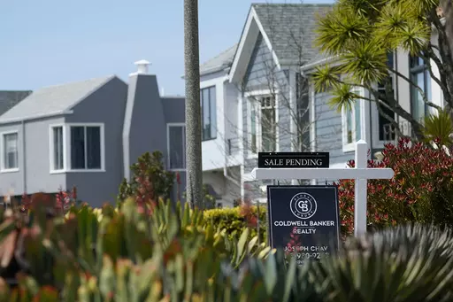 A Sale Pending sign hangs in front of a property in San Francisco, Tuesday, April 18, 2023. Planning a wedding and buying a home are two of the most expensive milestones of adult life, and couples with both of these goals may wonder how they’ll pay for it all. After all, new mortgages cost more now than ever, and wedding catering alone can easily cost five figures. (AP Photo/Jeff Chiu, File)