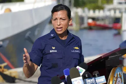 U.S. Coast Guard Captain Jo-Ann F. Burdian details the search of 38 missing migrants at a news conference, Wednesday, Jan. 26, 2022, in Miami Beach, Fla. One migrant was found clinging to the hull of an overturn vessel and one body was recovered off the coast of Fort Pierce, Fla. The migrants left the Bahamas on Saturday in what the Coast Guard suspects is a human smuggling operation. (AP Photo/Marta Lavandier)
