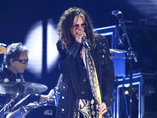 Steven Tyler, of the musical group Aerosmith, performs at the 62nd annual Grammy Awards in Los Angeles on  Jan. 26, 2020. Tyler has voluntarily entered a rehabilitation program, forcing the Boston-based rock band to cancel the first portion of its upcoming Las Vegas residency. (Photo by Matt Sayles/Invision/AP, File)