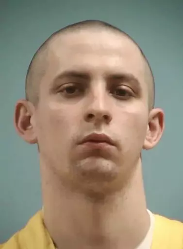 This image provided by the Mississippi Department of Corrections shows Axel Cox, 24, of Gulfport, Miss. Cox, who burned a cross in his front yard to intimidate his Black neighbors in December 2020, was sentenced Thursday, March 9, 2023, to 42 years in prison. (Mississippi Department of Corrections via AP, File)