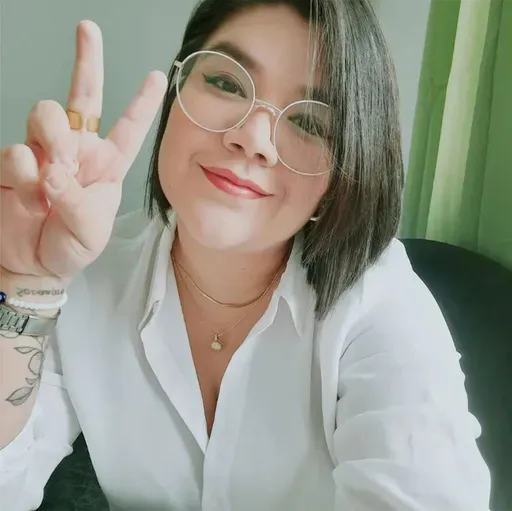 In this undated family photo, Venezuelan Edni Lopez, a political science professor and award-winning poet, flashes a vee sign at her home in Caracas, Venezuela. (Courtesy of family via AP)