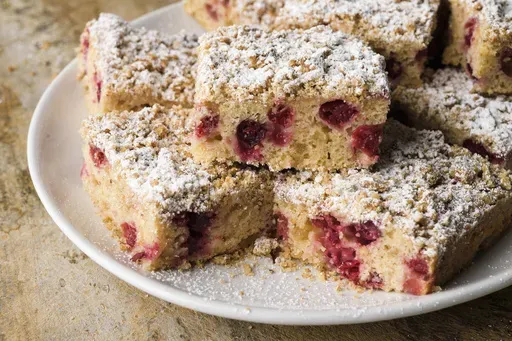 This image released by Milk Street shows a recipe for cranberry and candied ginger buckle. (Milk Street via AP)