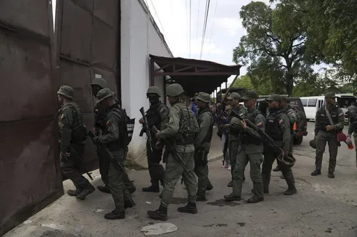 Soldiers raid the Tocorón Penitentiary Center, in Tocorón, Venezuela, Wednesday, Sept. 20, 2023. The Tren de Aragua gang originated at the prison. The Biden administration on Thursday, July 11, 2024, sanctioned the Venezuelan gang allegedly behind a spree of kidnappings, extortion and other violent crimes tied to migrants that have spread across Latin America and the United States. (AP Photo/Ariana Cubillos, File)