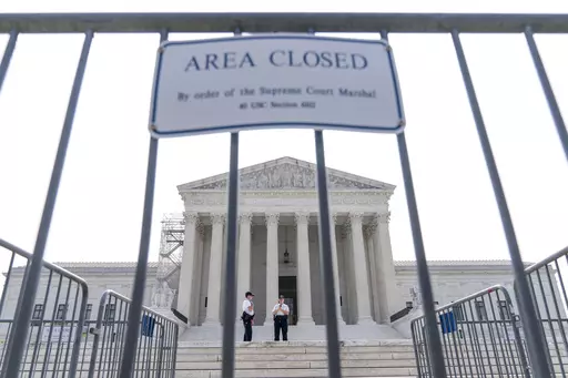 Security works on the steps of the Supreme Court, Friday, June 30, 2023, as decisions are expected in Washington. A year after its sweeping gun rights ruling, the Supreme Court has agreed to decide whether judges are going too far in striking down restrictions on firearms. The justices said Friday they will hear the Biden administration’s appeal of one such ruling that struck down as unconstitutional a federal law meant to keep guns away from people who have domestic violence restraining order
