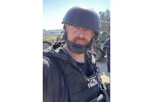 Reuters safety adviser Ryan Evans takes a selfie while working with a news reporting team near the border with Gaza in Be'eri, southern Israel, Feb. 8, 2024. (Ryan Evans/Reuters via AP)