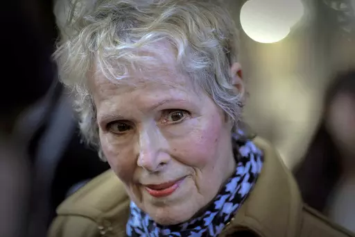 E. Jean Carroll talks to reporters outside a courthouse in New York, March 4, 2020. Federal Judge Lewis A. Kaplan issued an order Monday, April 10, 2023, directing parties to notify him if Trump plans to attend a New York trial later in the month resulting from Carroll's claims that he raped her in a department store dressing room in the 1990s. (AP Photo/Seth Wenig, File)