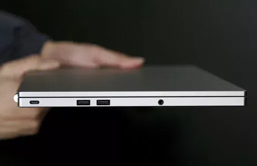 This Tuesday, March 10, 2015 photo shows, from left, the USB Type-C port, two standard USB ports, and headphone jack on a laptop, in San Jose, Calif.  Compared with larger companies, many small businesses have fewer resources to dedicate to cybersecurity, leaving them vulnerable to the ever-evolving tactics of cybercriminals. To protect themselves from cyberthreats, business owners should evaluate their online systems to understand where their data lives and what information needs to be kept saf