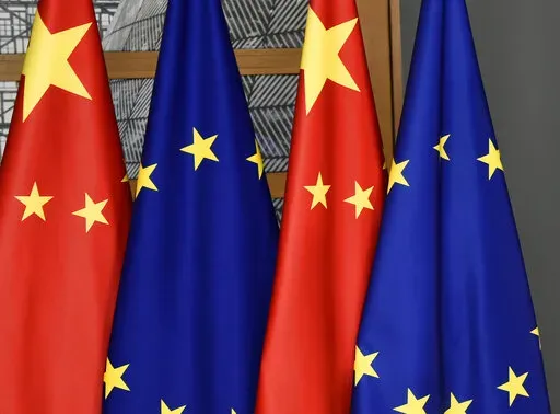 EU and Chinese flags are seen at the Europa building in Brussels, Tuesday, Dec. 17, 2019. The European Union will seek China's assurances that it won't assist Russia in circumventing economic sanctions leveled over the invasion of Ukraine at an annual summit Friday, April 1, 2022. (John Thys/Pool Photo via AP, File)