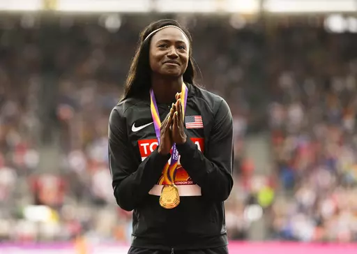 United States' Tori Bowie gestures after receiving the gold medal she won in the women's 100m final during the World Athletics Championships in London, Monday, Aug. 7, 2017. Tori Bowie, the sprinter who won three Olympic medals at the 2016 Rio de Janeiro Games, has died, her management company and USA Track and Field said Wednesday, May 3, 2023. Bowie was 32. She was found Tuesday in her Florida home. No cause of death was given. (AP Photo/Alastair Grant, File)