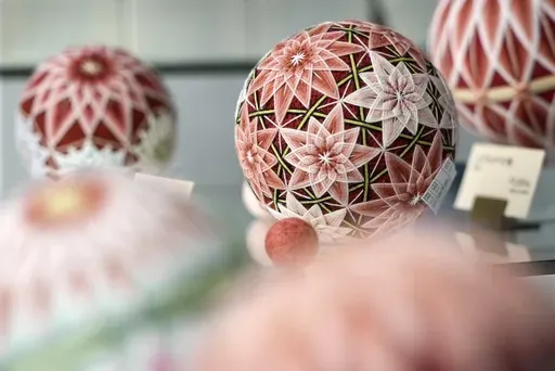 The temari balls are displayed at Sanuki Kagari Temari in Kawaramachi, Kagawa prefecture, Japan, on Sept. 5, 2024. (AP Photo/Ayaka McGill)