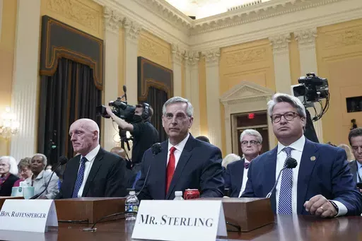 Rusty Bowers, Arizona state House Speaker, from left, Brad Raffensperger, Georgia Secretary of State, and Gabe Sterling, COO for the Georgia Secretary of State’s Office, attend a hearing investigating the Jan. 6 attack on the U.S. Capitol at the Capitol in Washington, June 21, 2022. With six months to go before the presidential election, concerns are running high among election officials that public distrust of voting and ballot counting persists. Sterling is part of an effort that seeks to br