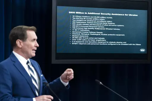 Pentagon spokesman John Kirby speaks during a media briefing at the Pentagon, Wednesday, April 13, 2022, in Washington. Behind him is a list of security items the U.S. is providing to Ukraine. (AP Photo/Alex Brandon)