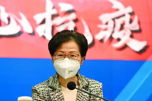 Hong Kong Chief Executive Carrie Lam speaks during a news conference at the government headquarters in Hong Kong, Wednesday, March 9, 2022. Hong Kong's chief executive said Sunday, March 20, that the government would consider lifting strict social distancing measures as new infections in the city continued trending downward.(Peter Parks/Pool Photo via AP, File)