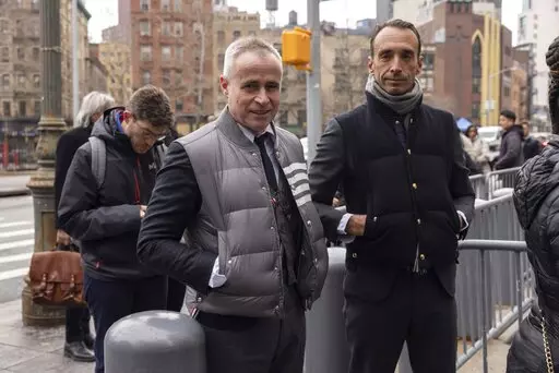 Fashion designer Thom Browne waits in line outside Manhattan federal court, Monday, Jan. 9, 2023, in New York. (AP Photo/Yuki Iwamura)