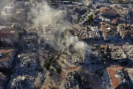 Destroyed buildings are seen from above in Antakya, southeastern Turkey, Thursday, Feb. 9, 2023. The Turkish government has for years tempted fate by not enforcing modern construction codes at the same time it was allowing — and in some cases, encouraging — a real estate boom in earthquake-prone areas, according to experts in geology and engineering who repeatedly issued warnings. (AP Photo/Hussein Malla)