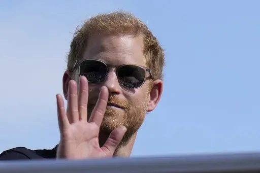 Britain's Prince Harry, the Duke of Sussex, waves during the Formula One U.S. Grand Prix auto race at Circuit of the Americas, on Oct. 22, 2023, in Austin, Texas. (AP Photo/Nick Didlick, File)